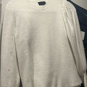Beautiful sweater with pearl embellishments on the sleeve